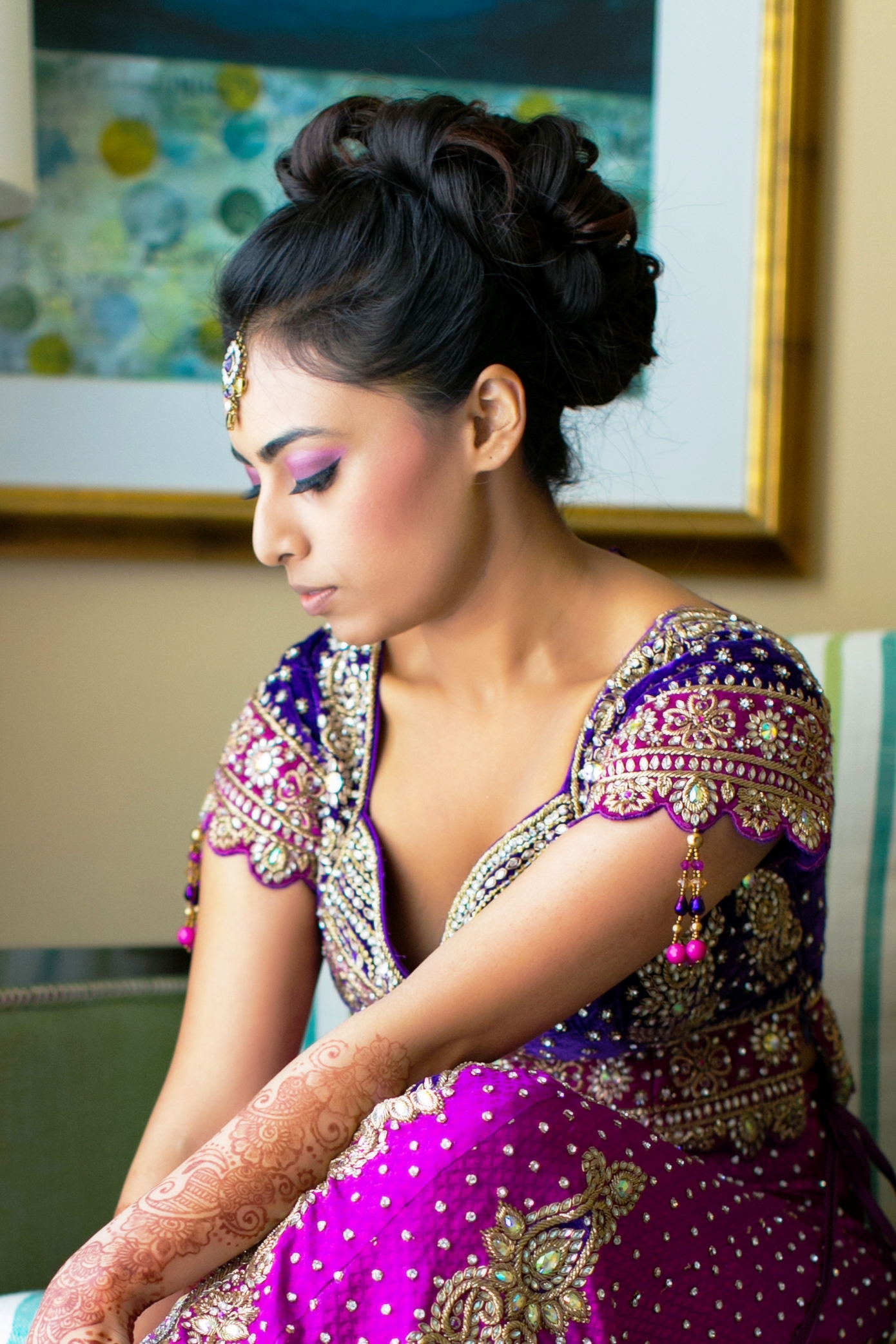 Photo of Bridal makeup with silver lehenga and tassels on sleeves